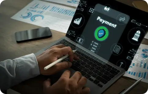 Billing person using a laptop displaying a digital payment interface with financial icons and analytics in the background.